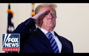 Trump salutes Marine 1 after arriving back at the White House