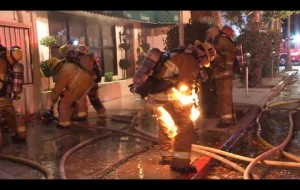 Firefighter catches fire while battling a structure fire